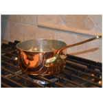 copper sauce pans on stove small