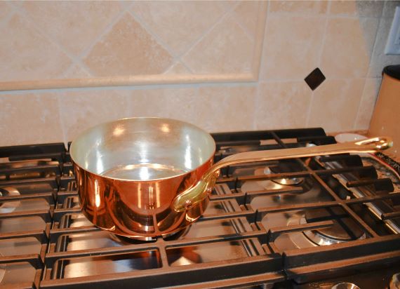 copper-saucepan-on-grill